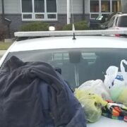 Local Law Enforcement Officers Collect Warm Clothing for Residents in Need