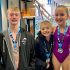 Bass, McMahon, and Wellnitz Win Medals at Optimist Swim Meet