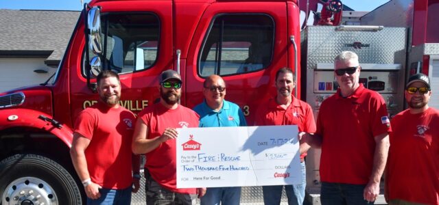Casey’s Marks Reopening with $2,500 Gift to Ortonville Fire Department
