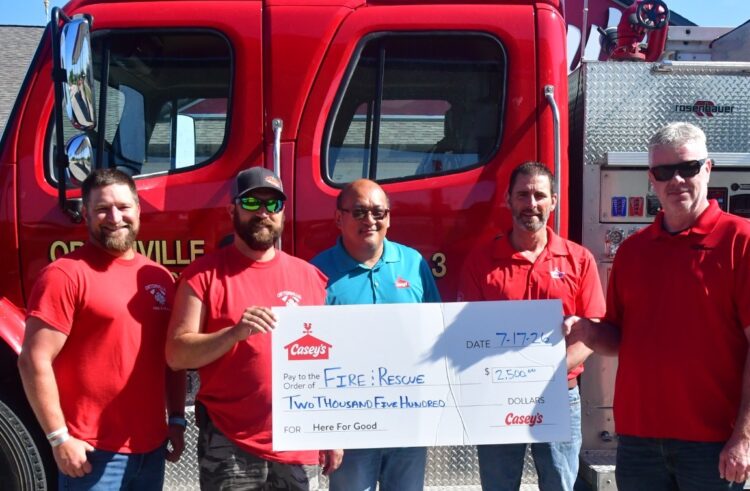 Casey’s Marks Reopening with $2,500 Gift to Ortonville Fire Department